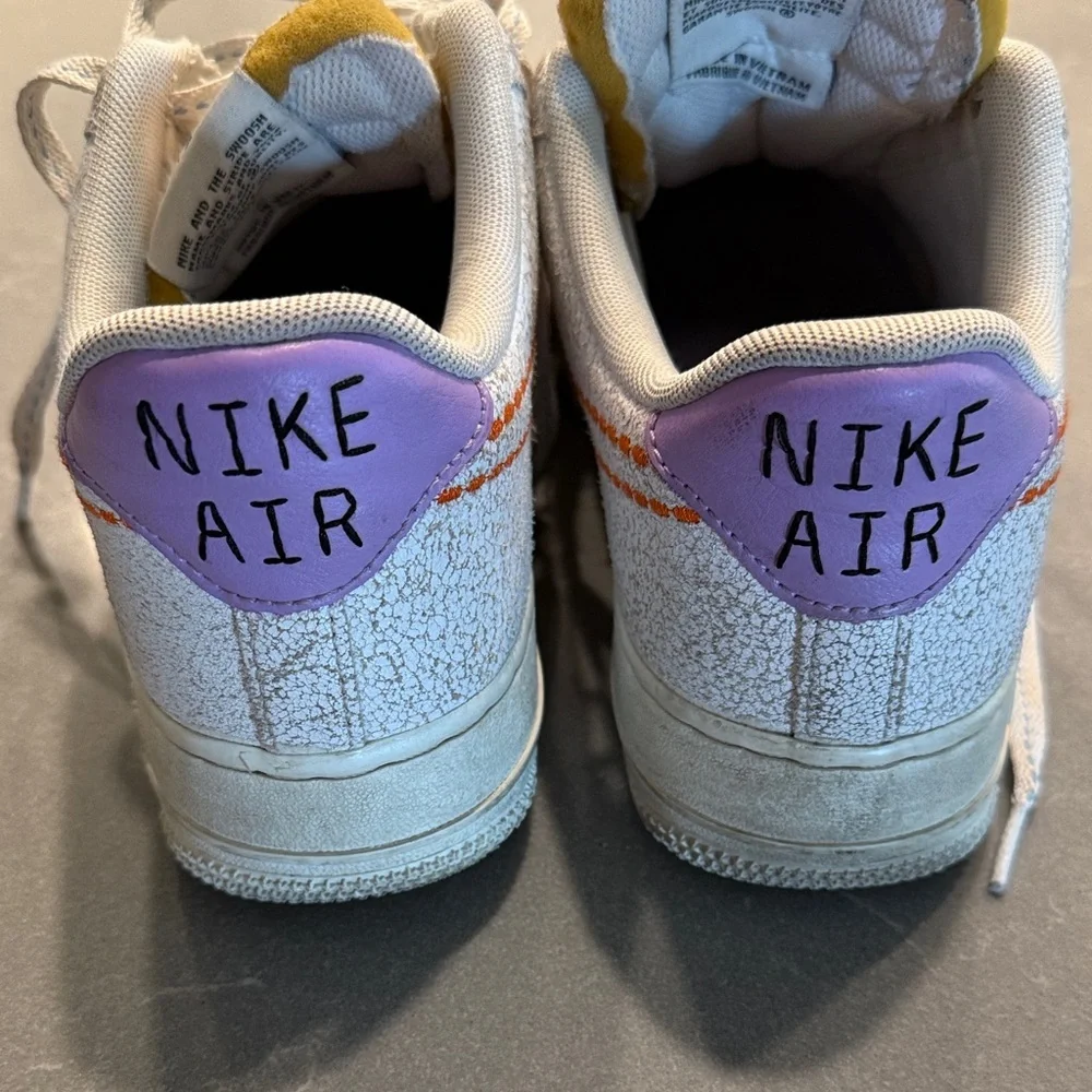Nike Air Force 1 White and Purple Athletic Shoes stitched design